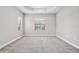 Spacious, empty bedroom with soft carpet, neutral paint, and natural light at 208 Ariano Ave, Nokomis, FL 34275
