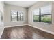 Bright, empty bedroom with tile floors and large windows that offer natural light at 208 Ariano Ave, Nokomis, FL 34275