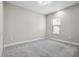 Neutral bedroom with grey carpet, white trim, and window with blinds offering natural light at 208 Ariano Ave, Nokomis, FL 34275