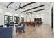 Elegant clubhouse interior with stylish furnishings, exposed wood beams and ample gathering space at 208 Ariano Ave, Nokomis, FL 34275