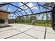 Large screened lanai area overlooks the backyard, providing an outdoor space at 208 Ariano Ave, Nokomis, FL 34275