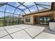 Spacious screened-in patio with concrete flooring, ideal for outdoor relaxation and entertainment at 208 Ariano Ave, Nokomis, FL 34275