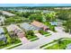An aerial view of three beautiful single-Gathering homes with a swimming pool, set in a well-maintained community at 2085 Mattamy Ct, Venice, FL 34292