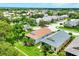 An aerial view of residences featuring meticulously maintained landscaping and mature trees in a suburban neighborhood at 2085 Mattamy Ct, Venice, FL 34292
