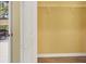 Walk-in closet with shelving and wooden floors, adjacent to a screened lanai at 2085 Mattamy Ct, Venice, FL 34292