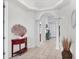 Elegant foyer showcasing tiled floors, arched doorways, and decorative furnishings for a welcoming entrance at 2085 Mattamy Ct, Venice, FL 34292
