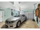 Spacious garage with car and equipment provides ample storage and parking at 2085 Mattamy Ct, Venice, FL 34292