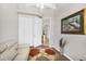 Comfortable living room features a couch and decor on wood-look flooring at 2085 Mattamy Ct, Venice, FL 34292