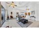 Bright living area with tile floors, a ceiling fan, and sliding glass doors for seamless indoor-outdoor living at 2085 Mattamy Ct, Venice, FL 34292