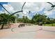 Inviting park fountain with benches, picnic tables and tall palm trees on a sunny day at 2085 Mattamy Ct, Venice, FL 34292
