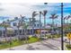 Picturesque street view showcasing buildings with awnings, palm trees, decorative lights, and a pedestrian crosswalk at 2085 Mattamy Ct, Venice, FL 34292
