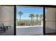 Balcony with beachfront views, palm trees, and a black metal fence at 222 Beach Rd # 7, Sarasota, FL 34242