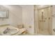 Bathroom featuring a single sink vanity and a shower with accessibility railing and shower curtain at 222 Beach Rd # 7, Sarasota, FL 34242