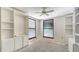 Bedroom featuring dual windows with blinds and white built in storage cabinets at 222 Beach Rd # 7, Sarasota, FL 34242