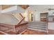 Grand foyer area with multiple staircases and unique architectural design at 222 Beach Rd # 7, Sarasota, FL 34242