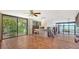 Bright living area boasting terracotta tile floors and large sliding glass doors at 222 Beach Rd # 7, Sarasota, FL 34242