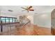 Open living area with terracotta tile, stairs, and a view to a beach at 222 Beach Rd # 7, Sarasota, FL 34242
