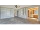Spacious living room features custom built-ins and access to ensuite bathroom and closets at 222 Beach Rd # 7, Sarasota, FL 34242