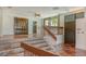 Spacious living area featuring terracotta tile, multiple stairs, and natural light at 222 Beach Rd # 7, Sarasota, FL 34242