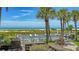 Community swimming pool surrounded by well-manicured landscaping and offering stunning beachfront views at 222 Beach Rd # 7, Sarasota, FL 34242