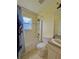 Bathroom with a tub/shower combo, toilet, and sink, with an 'Avengers' curtain rod at 2403 Trianna St, North Port, FL 34291
