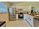 Bright kitchen features stainless steel appliances, butcher block countertops and ample cabinet space at 2403 Trianna St, North Port, FL 34291