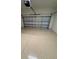 Spacious two-car garage with sealed floors and automatic door at 24827 Buckingham Way, Port Charlotte, FL 33980