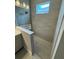 Tiled walk-in shower with glass enclosure, modern fixtures, and neutral tones for a sleek look at 24827 Buckingham Way, Port Charlotte, FL 33980