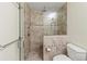 Bathroom with a glass walk-in shower and tiled surround at 2515 Huntington Ave, Sarasota, FL 34232