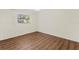 Bedroom featuring laminate flooring and window at 2515 Huntington Ave, Sarasota, FL 34232