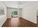 Spacious bedroom featuring laminate flooring and screened-in outdoor pool view at 2515 Huntington Ave, Sarasota, FL 34232