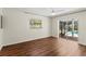 Spacious bedroom featuring laminate flooring and screened-in outdoor pool view at 2515 Huntington Ave, Sarasota, FL 34232
