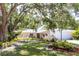 Lovely single-story home, showcasing beautiful landscaping and a welcoming front yard at 2515 Huntington Ave, Sarasota, FL 34232
