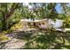 A charming single-story home boasting a beautifully landscaped front yard and inviting curb appeal at 2515 Huntington Ave, Sarasota, FL 34232