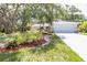 Charming home with a well-maintained front yard, beautiful plants, and a two-car garage at 2515 Huntington Ave, Sarasota, FL 34232