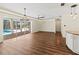 Bright living area with view of a screened-in pool area and modern recessed lighting at 2515 Huntington Ave, Sarasota, FL 34232