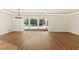 Open living space overlooking screened-in pool area with modern ceiling and wall lighting at 2515 Huntington Ave, Sarasota, FL 34232