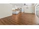 Spacious layout featuring an open living space connected to kitchen with granite countertops and stainless appliances at 2515 Huntington Ave, Sarasota, FL 34232