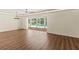 Open living space overlooking screened-in pool area with modern ceiling and wall lighting at 2515 Huntington Ave, Sarasota, FL 34232