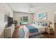 Bright main bedroom with a pool view, wood floors, and modern coastal decor at 2515 Huntington Ave, Sarasota, FL 34232