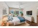 Bright main bedroom with a pool view, wood floors, and coastal decorations at 2515 Huntington Ave, Sarasota, FL 34232