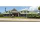 A well-maintained restaurant exterior with a green roof and lush landscaping enhancing its curb appeal at 2515 Huntington Ave, Sarasota, FL 34232