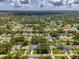 Wonderful aerial view of the community with a highlighted single Gathering house with lots of vegetation at 2546 Malibu Ln, North Port, FL 34286