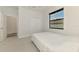 This cozy bedroom features plush carpet, a modern window, and ample closet space at 2546 Malibu Ln, North Port, FL 34286