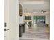 Bright, open-concept living room showcases a modern kitchen, comfortable seating, and backyard views at 2546 Malibu Ln, North Port, FL 34286