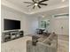 Cozy living room with a large TV, comfortable seating, and an inviting atmosphere at 2546 Malibu Ln, North Port, FL 34286