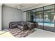 A screened in patio area has an outdoor sectional and view of the pool at 2546 Malibu Ln, North Port, FL 34286