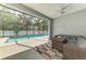 View of the pool and screened in patio, along with outdoor seating at 2546 Malibu Ln, North Port, FL 34286