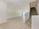 Spacious living room with light tile floors and a staircase at 317 Via Tuscany Ave, Sarasota, FL 34243