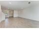 Spacious living room featuring wood-look tile flooring, recessed lighting, and natural light at 317 Via Tuscany Ave, Sarasota, FL 34243